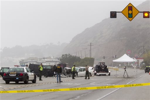 Los Angeles County Sheriff's deputies investigate the scene of a collision involving three vehicles in Malibu, Calif. on Saturday, Feb. 7, 2015. Officials said former Olympian Bruce Jenner was a passenger in one of the cars involved in the Pacific...