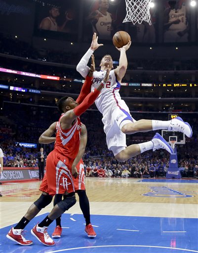 Los Angeles Clippers forward Blake Griffin, right, shoots over Houston Rockets center Dwight Howard during the first half of Game 6 in a second-round NBA basketball playoff series in Los Angeles, Thursday, May 14, 2015. (AP Photo/Jae C. Hong)