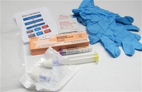 In this May 13, 2015 photo, the contents of a drug overdose rescue kit is seen at a training session in Buffalo, N.Y., on how to administer naloxone, which reverses the effects of heroin and prescription painkillers. The kits are being provided to...