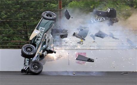 Ed Carpenter hits the wall in the second turn during practice before qualifications for the Indianapolis 500 auto race at Indianapolis Motor Speedway in Indianapolis, Sunday, May 17, 2015. Carpenter walked away from the crash and has been released...