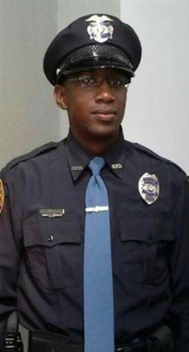 This undated photo released by the Hattiesburg Police Department, shows Officer Liquori Tate in Hattiesburg, Miss. Officer Tate and Officer Benjamin Deen were fatally shot during a traffic stop, Saturday evening, May 9, 2015, in the southern...