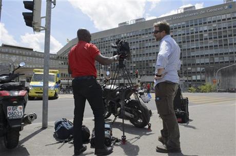 A TV team is waiting in front of Geneva's General Hospital in Geneva, Switzerland, Sunday, May 31, 2015. U.S. Secretary of State John Kerry broke his leg in bike crash outside of Geneva on Sunday and called off the rest of a four-nation diplomatic...