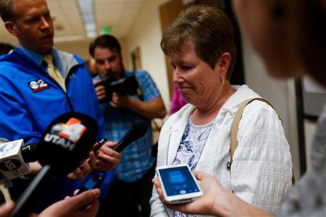 Kathy Wride, mother of Sgt. Cory Wride, speaks to the media after the jury found Utah teenager Meagan Grunwald guilty in a 50-mile crime spree that left one sheriff's deputy dead and another wounded, at the Fourth District Court in Provo, Utah on...