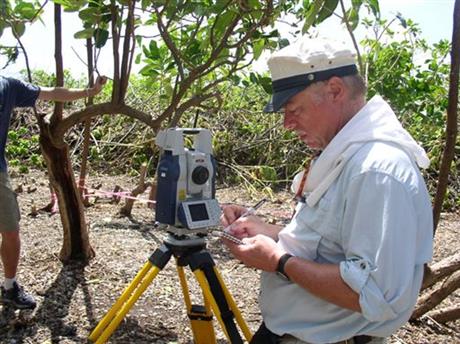 In this undated photo provided by The International Group for Historic Aircraft Recovery in June 2015, Ric Gillespie, the group's co-founder, surveys an area during an expedition to the South Pacific island of Nikumaroro in Kiribati. Gillespie and...