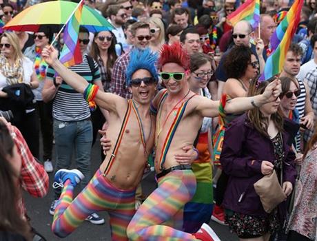 Participants on O'Connell Street in Dublin take part in a Gay Pride parade in Dublin Saturday June 27, 2015. (Niall Carson/PA via AP) 