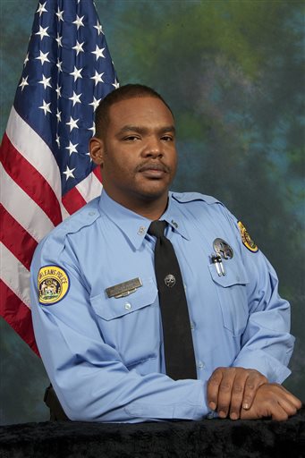 This undated photo provided by the City of New Orleans shows Officer Daryle Holloway. The New Orleans Police Department said Holloway was shot while transporting a suspect, Travis Boys, who managed to get his handcuffed hands from behind his back...