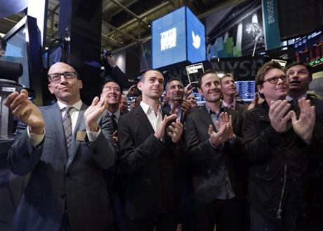 FILE - In this Nov. 7, 2013 file photo, front row, from left, then Twitter CEO Dick Costolo, Chairman and co-founder Jack Dorsey, and co-founders Evan Williams and Biz Stone, applaud as they watch the ringing of the opening bell at the New York...