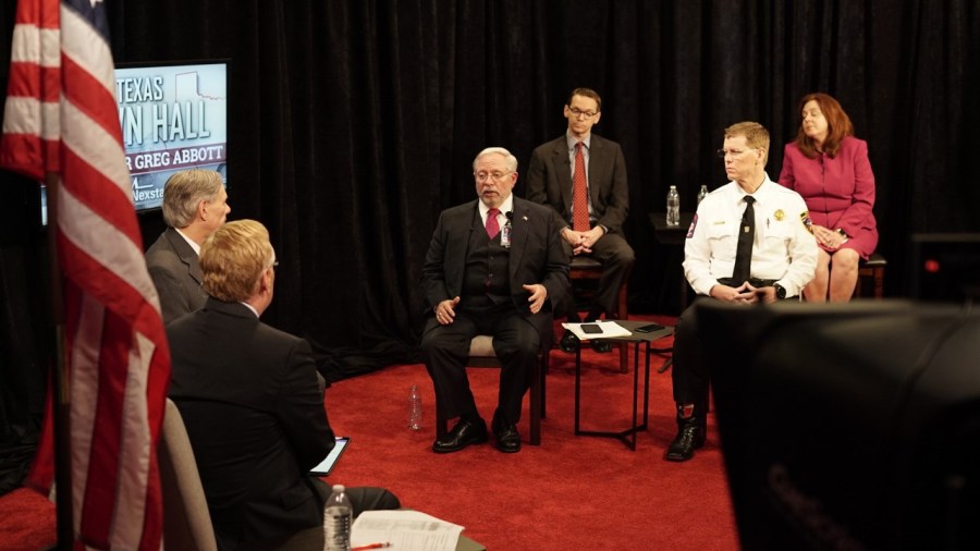 Texas Gov. Greg Abbott takes part in a virtual town hall addressing the coronavirus pandemic, along with Texas Department of State Health Services Commissioner Dr. John Hellerstedt, Texas Education Agency Commissioner Mike Morath, Chief of the Texas Division of Emergency Management Nim Kidd and Associate Commissioner of Laboratory and Infectious Disease Services at the Texas Department of State Health Services Imelda Garcia, in Austin, Texas, on March 19, 2020 (KXAN Photo/Andrew Choat)