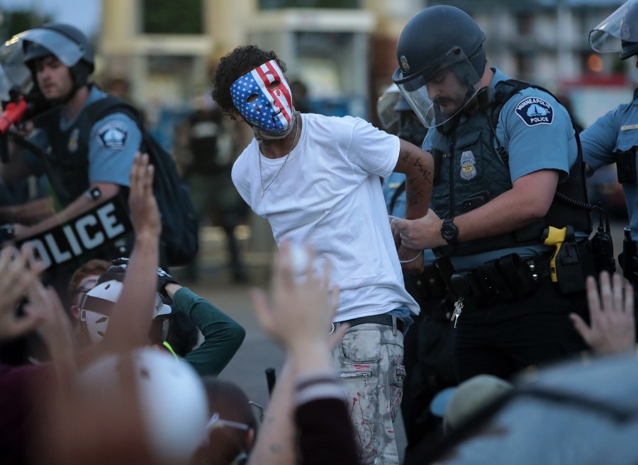 A demonstrator is arrested during a protest against police brutality and the death of George Floyd, on May 31, 2020 in Minneapolis, Minnesota. (Photo by Scott Olson/Getty Images)