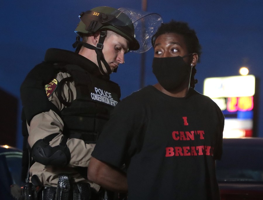 A demonstrator is arrested during a protest against police brutality and the death of George Floyd, on May 31, 2020 in Minneapolis, Minnesota. (Photo by Scott Olson/Getty Images)