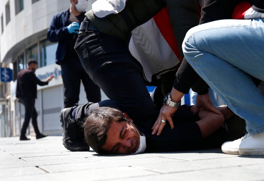 Turkish police officers arrest a demonstrator wearing a face mask for protection against the coronavirus, during May Day protests near Taksim Square, in Istanbul. The death of George Floyd has renewed scrutiny of immobilization techniques long used in policing around the world. (AP Photo/Emrah Gurel, File)