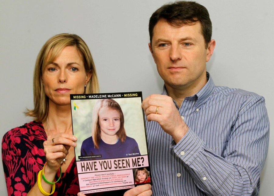 In this May 2, 2012 file photo, Kate and Gerry McCann pose with a missing poster depicting an age progression computer generated image of their daughter Madeleine at nine years of age, to mark her birthday and the 5th anniversary of her disappearance during a family vacation in southern Portugal in May 2007. McCann’s family is hoping for closure in the case after a key suspect was identified in Germany and as authorities there say they believe the missing British girl is dead. (AP Photo/Sang Tan, File)