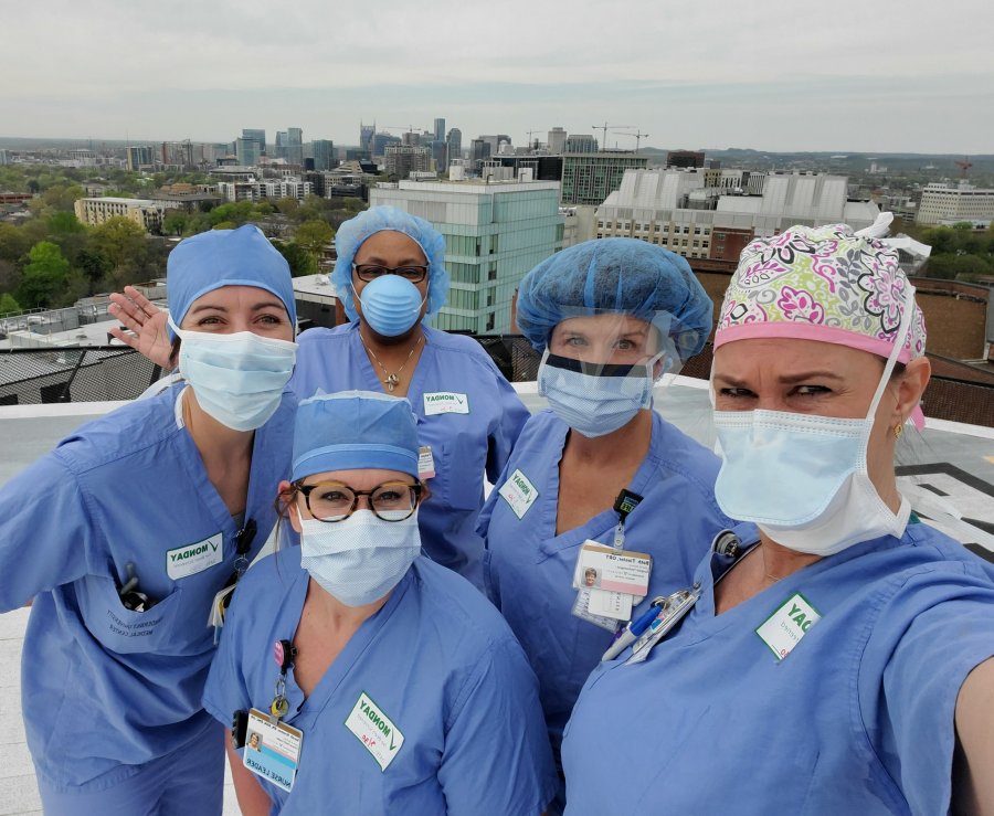 Staff prays on Vanderbilt's helipad