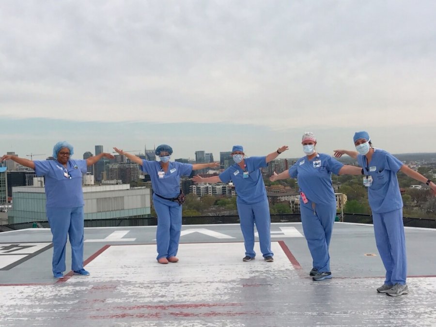 Staff prays on Vanderbilt's helipad