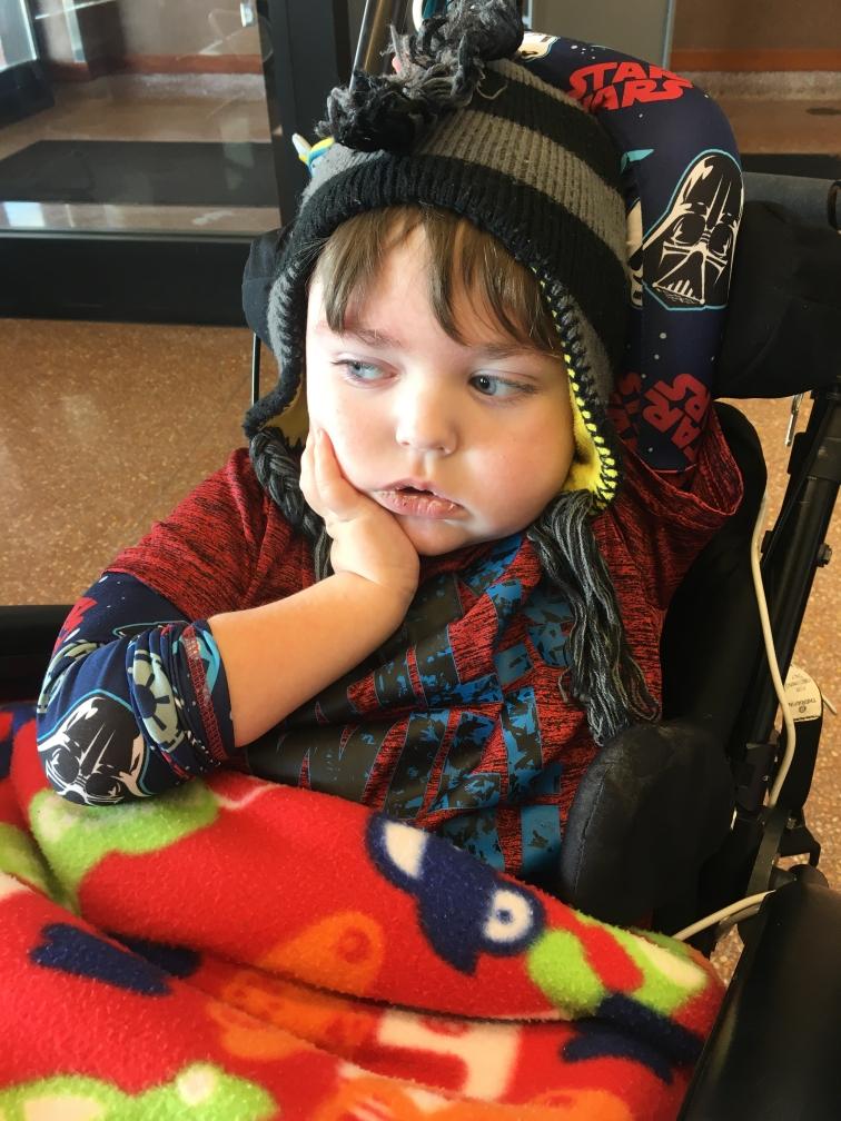 Boy sitting in wheelchair 